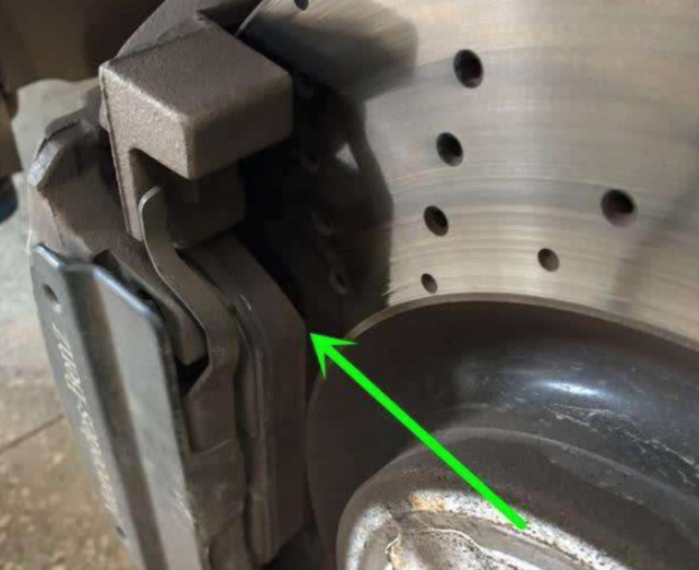 What caused the abnormal noise of the newly installed brake pads?